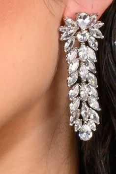 Crystal jewels come to life in the gorgeous design. Our HELENA earrings are long and filled with beauty to complete your entire look. The perfect amount of glamour and high style to add to any special occasion attire. Handcrafted Highest Quality Swarovski / Cubic Zirconia Platinum plated Guards against scratches and tarnish. approximate size 2.5" length 1" width Nickel free Free Shipping in USA Cubic Zirconia Cluster Dangle Earrings For Party, Glamorous Long Drop Sparkling Jewelry, Glamorous Cluster Earrings With Sparkling Stones For Formal Occasions, Glamorous Formal Cluster Earrings With Sparkling Stones, Glamorous Sparkling Cluster Earrings For Formal Events, Glamorous Silver Jewelry For Gala, Glamorous Long Drop Chandelier Earrings With Cubic Zirconia, Glamorous Long Drop Jewelry With Sparkling Stones, Glamorous Long Drop Cubic Zirconia Chandelier Earrings