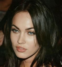 a close up of a woman with dark hair