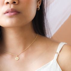 Our dainty zodiac coin necklace features a round scalloped pendant with a zodiac sign on it. …………………………………. Details: Pendant is Gold or Silver Plated over Brass measuring 12mm Chain is 14k Gold/Silver Plated, Gold Filled or Sterling Silver Average necklace length is 18" About Your Jewelry If you are not wearing your jewelry it is best to store it in a cool, dry place such as your gift box that is included in your ord 14k Gold Round Coin Necklace Fine Jewelry, Moon Charm Round Pendant Jewelry For Her, Everyday Gold Plated Coin Jewelry, Gold Plated Charms Necklace With Round Shape, Gold Plated Coin Pendant Jewelry, Round Gold Plated Charms Necklace, Fine Jewelry Charm Necklace With Tarnish Resistant Round Pendant, Fine Jewelry Round Pendant Charm Necklace, Yellow Gold Coin Pendant Necklace In Sterling Silver