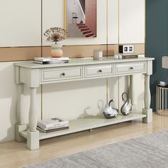 a white console table with two drawers on each side