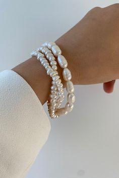 Three lines of pearls Gives a nice elegant look to your outfit Clasp Elegant Beaded Baroque Pearl Bracelets, White Pearl Embellished Beaded Bracelets, Pearl White Bangle Pearl Bracelet, Pearl White Pearl Bangle Bracelet, Elegant Baroque Pearl Beaded Bracelets In Pearl White, White Baroque Pearl Bracelets For Formal Occasions, Formal White Baroque Pearl Bracelets, Elegant Beaded Pearl White Bracelet, Elegant White Pearl Beaded Bracelets