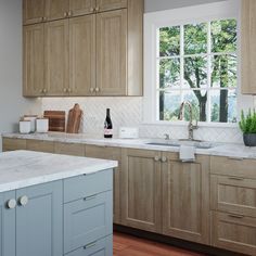 a kitchen with wooden cabinets and white marble counter tops, along with a window over the sink