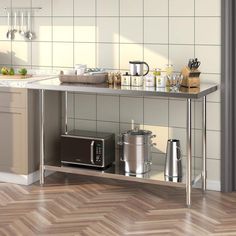 a kitchen with stainless steel counter tops and appliances on the shelf in front of it