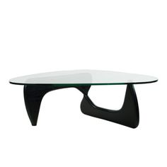 an oval glass table with black legs and a curved design on the top, against a white background