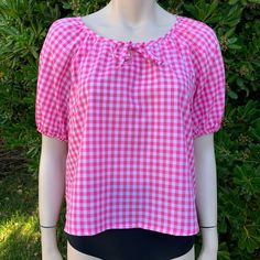 This is a super cute pink gingham blouse I love the little tie on the chest and the poof sleeves! It's also sort of cropped so that just makes it extra cute! It's very lightweight and perfect for summer My guess would be best fits up to a medium but pls see measurements as there is no tag on this! Measurements as follows: Pit to pit is 19" inches  Length is 22" inches I ship priority mail with tracking! Thanks for looking :) Plaid Short Sleeve Beach Top, Casual Gingham Puff Sleeve Blouse, Casual Gingham Blouse With Puff Sleeves, Puff Sleeve Tops For Spring Picnic, Gingham Puff Sleeve Blouse For Day Out, Summer Plaid Short Sleeve Blouse, Plaid Short Sleeve Summer Blouse, Summer Puff Sleeve Tops For Picnic, Preppy Plaid Summer Tops