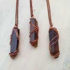 "Raw smokey lemurian quartz point necklace. Crystal wire wrap crystal pendant, heal crystal necklace. Wire wrap jewelry. These necklaces are stunning with a unique color and wrapping to each individual pendant. Each one is unique. Chain length choice of 14\", 16\", 18\", 20\", 24\". These necklace can be worn with others. Smokey Quartz is an excellent grounding stone. It gently neutralises negative vibrations and is detoxifying on all levels, prompting elimination of the digestive system and pro Copper Wire Wrapped Crystal Necklace For Healing, Healing Copper Wire Wrapped Crystal Necklace, Wire Wrapped Crystal Pendant Necklace For Jewelry Making, Brown Wire Wrapped Crystal Necklace For Gift, Crystal Spells, Crystal Wire Wrap, Wire Wrapped Crystal Pendant, Lemurian Quartz, Earthy Jewelry