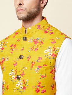 This digital print-on mustard linen bundi jacket is perfect for your next summer event. It features front buttons fastening, and a mandarin collar. The floral mustard bundi jacket is made of cotton material.
Style Tip: Pair it with a blue shirt and white jeans.
NOTE: Ready-to-Ship in Size L Traditional Bandhgala With Stand Collar For Spring, Summer Cotton Outerwear With Stand Collar, Yellow Long Sleeve Nehru Jacket For Festivals, Yellow Printed Kurta For Spring, Spring Yellow Cotton Kurta, Festive Cotton Stand Collar Outerwear, Festive Cotton Outerwear With Stand Collar, Traditional Floral Print Bandhgala For Spring, Traditional Spring Bandhgala With Floral Print