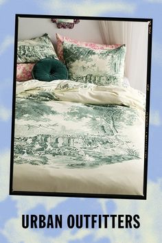 an image of a bed with pillows on it and the words urban outfitters above it