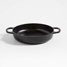 black cast iron skillet on white background