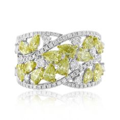 A dazzling, mystifying canary fancy yellow diamonds is in a class all by itself. This canary fancy yellow with white pave white diamond ring is as luxurious as it gets!Metal: 18K White GoldPear-shape Canary Fancy Yellow Diamonds: 1.96ct t.w. Mix-shape Diamonds: 0.84ct t.w. Setting: Prong, Pave Width: 15mm Cocktail Diamond Ring, Canary Diamond Ring, Yellow Diamond Jewelry, Canary Diamond, White Cocktails, White Cocktail, Real Queens, Yellow Diamonds, Fancy Yellow Diamond