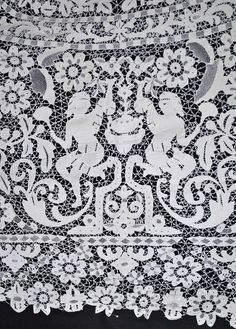 an old lace tablecloth with black and white designs