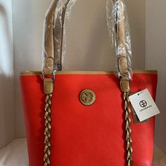 Giani Bernini Hand Bag Color: Chili Pepper Description: Keep Your Essentials Secure With Smart Storage Features. It’s The Perfect Blend Of Form, Functionand Fashion! *Measures 14”Hx9.25”Dx4.75” W 1.83lb *Center Divider Zipper,Magnetic Snap Closure Interior:2 Slip Pockets,1 Zipper Pocket,1 Id Window *Exterior:1 Back Slip Pocket,Hardware Logo And 2 Piece Pleating On Front Panel. *Interior: 2 Slip Pockets,1 Zipper Pocket,1 I.D Window. *Handle 9” L Drop Smartphone Pocket Organizer Pockets Red Bags With Braided Handles, Elegant Red Shoulder Bag With Braided Handles, Window Exterior, Messanger Bag, Hardware Logo, White Shoulder Bag, Pocket Organizer, Brown Tote, Brown Shoulder Bag