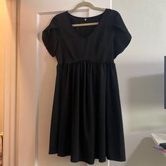 Black Baby Doll Dress Tulip Sleeves Satin Type Material Never Worn But No Tags Black Dresses For Daywear, Black Solid Color Dress For Daywear, Black Cotton V-neck Mini Dress, Black Baby Doll Dress, Black Baby Dolls, Tulip Sleeve, Baby Doll Dress, Tulip Dress, Essential Dress