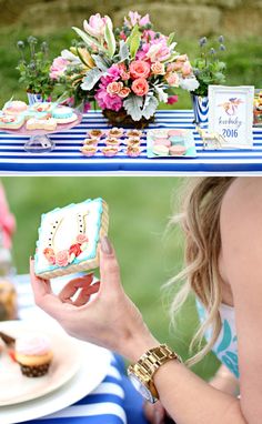 a woman holding a piece of cake in front of a table full of cupcakes