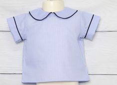 "Zuli Kids offers custom shirts for kids in many styles. Boys peter pan collar shirt is shown in blue gingham with navy piping but can come in most any color to match our baby boy rompers for special occasions such as Easter Outfits, Christmas Outfits and Baby Boy First Birthday Outfits. *Zuli Kids Premium Quality *Peter Pan Collar Shirt *65% cotton 35% Poly *Machine Wash Gentle *Button-Back Closures *Piping in Peter Pan Collar *Birthday, Christmas, Easter Shirts *Available in Size NB - 4T WHATS Collared Summer Tops For School, Cotton School Tops With Collar, Peter Pan Collar Shirt, Smocked Clothes, Baby Boy Shirts, Baby Boy First Birthday, Boys Long Sleeve Shirts, Baby Boy Dress, Sibling Shirts