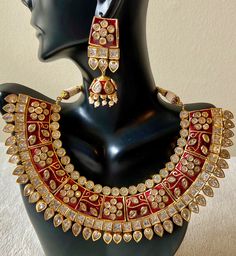 Gorgeous Dark Red Meenakari Polki Rajwada jewelry set. Comes with necklace, earrings, and maang tikka Luxury Ornate Meenakari Jewelry, Red Stone Work Sets For Gifts, Red Meenakari Temple Jewelry Traditional Wear, Red Sets With Stone Work For Gift, Red Meenakari Chandbali Necklaces, Red Meenakari Chandbali Necklace, Red Kundan Sets For Gift, Red Kundan Jewelry Set Gift, Traditional Red Jewelry Sets With Cutdana