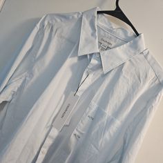 Nwt Men's Blue And White Calvin Klein Dress Shirt. Comes From A Pet Free And Smoke Free Home. Casual Calvin Klein Collared Shirt, Calvin Klein White Button-up Shirt, Casual Calvin Klein Shirt With Spread Collar, Calvin Klein Casual Shirt With Spread Collar, Calvin Klein Spring Button-up Shirt, Classic Calvin Klein Shirt For Summer, Calvin Klein White Long Sleeve Shirt, Classic Calvin Klein Summer Shirt, Casual Calvin Klein Button-up Shirt