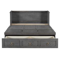 an antique style bed with two drawers on the bottom and one open drawer below it