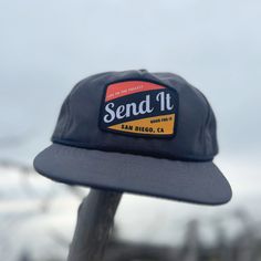 Your ticket to adventure and style. Designed with premium 100% nylon, this hat guarantees a lightweight and comfortable experience. The plastic snapback closure ensures a secure fit, while the breathable interior mesh sweatband keeps you cool on every journey. Get ready to "send it" with confidence and flair – grab your Send It Cascade Rope Hat today! Waterproof 5-panel Travel Hat, Casual Flat Brim Snapback Hat For Adventure, Casual Flat Brim Trucker Hat For Adventure, Casual Trucker Hat With Flat Brim For Adventure, Urban Trucker Hat With Logo Patch For Outdoor, Casual Trucker Hat With Flat Bill For Adventure, Casual Flat Bill Trucker Hat For Adventure, Lightweight Snapback Hat For Outdoor, Breathable Flat Brim Snapback Hat For Outdoor