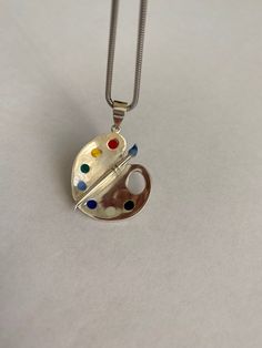 Unique sterling silver pendant for art lovers paint pallet pandant For more art palette pednats check here https://www.etsy.com/listing/683600798/art-palette-pendant-925-sterling-silver?ga_search_query=palette&ref=shop_items_search_3&pro=1&frs=1 For art palette earrings check here Enamel Necklace Pendant, Art Teacher Gifts, Painters Palette, Palette Art, Artist Palette, Pallet Painting, Ceramic Pendant, Silver Art, Gifts For An Artist