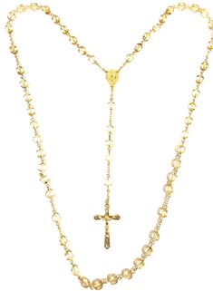 Gold tone Rosary made with 8mm gold tone crystal glass beads. Center is gold tone 3/4 inch known as the Immaculate Conception. Cross is gold tone and 1 3/4 inches.  The rosary is 22 1/2 inches long. Comes with a black velvet pouch. Luxury Gold Rosary As Gift, Gold Rosary With Beaded Chain, Gold Beaded Chain Rosary, Gold Rosary With Beaded Chain As Gift, Gold Beaded Chain Rosary As Gift, Yellow Gold Rosary With Round Beads, Gold Beaded Spiritual Rosary Bracelet, Gold Spiritual Rosary With Round Beads, Spiritual Gold Rosary Bracelet With Gold Beads