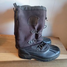 These are a vintage pair of Sorel, black, snowboots. They are a men's size 9 and we're made in Canada. The laces have been replaced. These have some wear from normal use and there is some rust on the d-rings, as you can see in the images. All sales are final.   The measurements are as follows: Heel to toe ( exterior sole): 12.25 inches Width (exterior sole) 4.5 inches Opening: 8 inches across Boot height: 14 in tall I could not get an accurate measurement of the interior of the boot.  If you have a wish list or are looking for something specific, please ask. I may have exactly what you are looking for.  As always please convo me with any questions or concerns regarding this item or with any international shipping questions. Unfortunately I do not accept returns or grant refunds. All shippi Rugged Winter Boots For Outdoor Work, Rugged Boots For Winter Outdoor Work, Rugged Boots For Outdoor Work In Winter, Winter Insulated Black Hiking Boots, Black Boots With Reinforced Toe For Cold Weather, Black Boots For Outdoor Work In Winter, Black Insulated Hiking Boots For Cold Weather, Insulated Black Boots For Outdoor Activities, Insulated Black Hiking Boots For Cold Weather