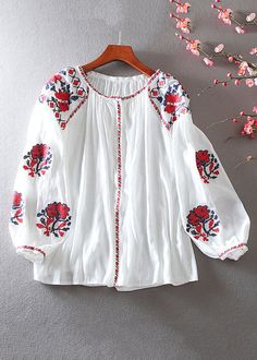 Long Sleeve Tops With Floral Embroidery For Summer, Cotton Blouse With Embroidered Bishop Sleeves, White Puff Sleeve Top With Floral Embroidery, White Blouse With Blouson Long Sleeves, Embroidered Cotton Bishop Sleeve Top, Long Sleeve Cotton Blouse With Embroidered Cuffs, Embroidered Bishop Sleeve Cotton Top, Cotton Embroidered Puff Sleeve Blouse, Folk Style Long Sleeve Top With Embroidered Cuffs