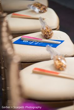 the chairs are lined up and ready to be used as place settings for wedding guests