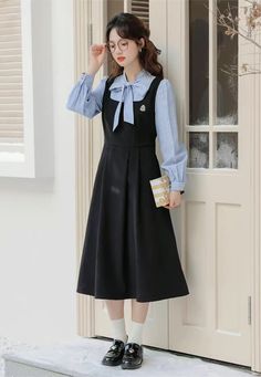 Faux two-piece layered dress with a stripe blouse with two buttons and a tie-up neckline, and a solid colored pinafore dress with a varsity embroidered badge, elastic waist and waist ties. S: 35.5" chest, 27" waist, 42" lengthM: 37" chest, 28.5" waist, 42" lengthL: 38.5" chest, 30" waist, 42" length Flannel Pinafore Dress, Pinafore Outfit, Dark Academia Dress, Vintage Striped Dress, Winter Sewing, Stripe Blouse, Fashion Guide, Layered Dress, Apron Dress