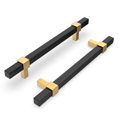 two black and gold door handles with square bars on each side, one in the shape of a rectangle