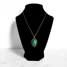 Malachite Pendant Necklace | Antique Silver or Gold | 24" Chain Clairvoyance + Transformation + Road Opener + Emotional Balance Carry your intentions wherever you go with a handmade Malachite pendant necklace. Each pendant is custom made with an antique gold or silver filigree base and comes with an 24" chain with lobster clasp fastening. Malachite is often referred to as the Stone of Transformation. It was a stone favored by the ancient Greeks and Egyptians for its protective and healing properties. Malachite is a heart chakra stone that works by removing whatever is blocking growth in your life and opening your heart and mind to new possibilities. Whether you are ready to take a leap of faith or feeling stagnant in life, this stone will give you clarity of purpose and the courage to move Vintage Brass Necklaces For Meditation, Green Brass Spiritual Necklaces, Spiritual Green Brass Necklaces, Green Brass Necklace For Gift, Vintage Emerald Pendant Necklace As Gift, Vintage Emerald Pendant Necklace Gift, Feeling Stagnant, Road Opener, Opening Your Heart