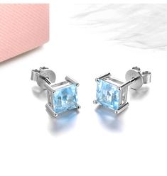 Elevate your look with these exquisite Stud Earrings, crafted in high-quality 925 Sterling Silver. They feature 6.0 x 6.0mm Square Cut Sky Blue Topaz stones that radiate captivating charm. The soft blue hue seamlessly complements the sterling silver setting, making them a versatile addition to any jewelry collection. Perfect for casual wear or special occasions. Specifications: Metal: 925 Sterling Silver Main Gemstone: Topaz Main Gemstone Cut: Square Cut Main Gemstone Size: 6.0 x 6.0mm Main Gems White Gold Earrings With Blue Topaz Birthstone, Silver Topaz Birthstone Earrings, White Gold Blue Topaz Gemstone Earrings, Classic Light Blue Sterling Silver Jewelry, White Gold Blue Topaz Earrings For Gift, Elegant Light Blue Sterling Silver Earrings, Silver Blue Topaz Earrings Fine Jewelry, Light Blue Topaz Gemstone Earrings, Light Blue Jewelry With Prong Setting For A Gift