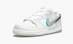 The Diamond Supply Co.  x Nike SB Dunk Low “White” is another chapter to the story of one of the most heralded sneaker designs of all time.  This 2018 release brings a fresh look to the classic Nike SB Dunk colorway that helped bring the model to the forefront of sneaker culture in the mid 2000s.  It features a pristine white leather upper in both croc and smooth textures for a reference to the original design.  From there it adds new details, including removable Velcro Swooshes in metallic silv Nike Sb Shoes, Nike Heels, Nike Sb Dunk Low Pro, Sneaker Culture, Nike Sb Dunk Low, Diamond Supply Co, Sb Dunk Low, Nike Sb Dunks Low, Nike Sb Dunk