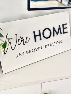 there is a sign that says we're home jay brown realtors