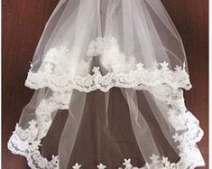 the veil is white and has flowers on it