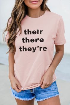 Pink Short Sleeve Letters Graphic T-shirt Tan Graphic Tee With Letter Print, Pink T-shirt With Letter Print For Everyday, Tan T-shirt With Letter Print For Spring, Tan Graphic Tee With Text Print, Graphic Tee With Text Print And Crew Neck, Short Sleeve Tops With Funny Text, Everyday Crew Neck Top With Funny Text, Funny Text Crew Neck Tops For Everyday, Casual Crew Neck Top With Funny Text