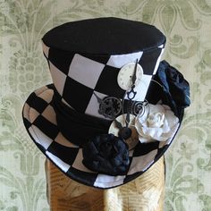 a black and white hat with flowers on it