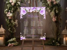 a wedding seating chart with flowers and candles