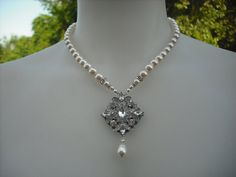 Hey, I found this really awesome Etsy listing at https://www.etsy.com/listing/99967024/ava-collection-art-deco-rhinestone-and Silver Vintage Charm Necklace For Wedding, Antique Silver Jewelry With Vintage Charm For Wedding, Silver Vintage Charm Necklaces For Weddings, Ornate Pendant Bridal Necklace For Wedding, Ornate Bridal Pendant Necklace For Wedding, Elegant Antique Silver Jewelry For Wedding, Elegant Vintage Charm Necklaces For Wedding, Vintage Pearl Necklace With Crystal For Wedding, Vintage Crystal Pearl Necklace For Wedding