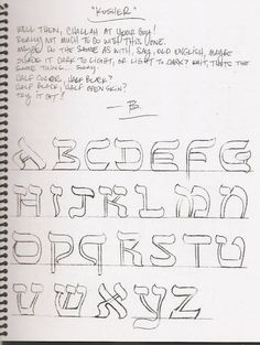 a handwritten alphabet is shown in black ink on a white paper with some writing underneath it