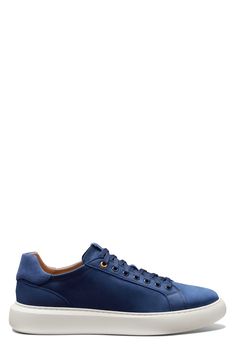 A rich leather upper lends street-savvy appeal to a low-profile sneaker designed with optimal cushioning and a sturdy cupsole for lasting wear. Water-resistant Cushioning: absorbs impact and distributes weight for consistent, buoyant comfort under each step Removable, cushioned insole Leather upper/textile lining/synthetic sole Made in Portugal Classic Blue Sneakers With Removable Insole, Blue Leather Sneakers With Cushioned Footbed, Blue Sneakers With Removable Insole And Plain Toe, Modern Blue Sneakers With Removable Insole, Blue Sneakers With Contrast Sole, Classic Blue Plain Toe Sneakers, Blue Suede Sneakers With Removable Insole, Blue Leather Sneakers With Perforated Toe Box, Blue Cushioned Leather Sneakers