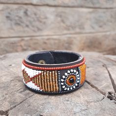 The collars are made from ethically sourced leather in Kenya. The collars are then hand beaded by Maasai women artisans from my Village in Kajiado who have mastered the art. The hardware is made from 100% recycled brass. TO MEASURE CORRECTLY Our Measurements are from the tip of the Buckle of the Collar to the second hole after the beaded section. If you are not sure about the Sizes please Contact us before making the order. African Bracelet, Female Dog Collars, African Bracelets, Beaded Dog Collar, Large Dog Collars, Personalized Dog Collars, Brown Leather Totes, Bracelet Leather, Maasai