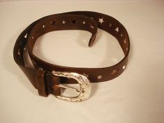 "Here is a Vintage 1980s Brown Leather Belt from the Express.  It has Rhinestones and Star Cutouts.  It will fit size s and M.  It is 36\" long not including the buckle and it is 1 1/4\" wide. Any questions, just ask me." Brown Leather Belt, Brown Belt, Suspender Belt, Suspenders, Belt Buckles, Leather Belt, Etsy Vintage, Belts, Brown Leather