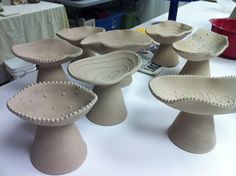 several ceramic bowls are sitting on a table