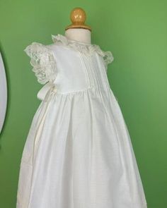 Made in Spain Dry Clean 50% Cotton, 50% Polyester Final sale, no exchanges nor returns are available Elegant Dresses With Pleated Bodice For Dress-up, Elegant Dresses With Pleated Bodice For Formal Occasions, Elegant White First Communion Dress For Spring, White Sleeveless Gown With Lace Trim, Elegant White Baptism Dress For Spring, Sleeveless Fitted First Communion Dress With Lace Trim, Elegant White Dress For Dress-up Occasions, White Gown With Fitted Bodice For Dress-up Occasions, White Gown With Fitted Bodice For Dress-up