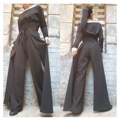 "Spectacular cotton two-piece set. Short blouse with long sleeves and open neck in a combination of black and white and ankle-length pants with a high waist with ties at the waist. The pants have a wide leg and sewn two rails on both sides that give asymmetry and elegance🤩Extravagant designs and high quality fabrics. The item from the pictures is size S  For more information feel free to ask questions. Material &Care Cotton and elastane  Machine wash 30oC Hand wash at low temperatures Do not ma Asymmetrical Cotton Bottoms For Fall, Cotton Two-piece Long Sleeve Sets, Cotton Two-piece Set With Long Sleeves, Fitted Cotton Wide Leg Sets, Fitted Cotton Sets With Wide Leg, Fitted Cotton Set With Wide Leg, Lady Pants, Short Blouse, Gothic Pants