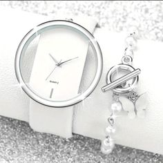 White & Silver 2-Piece Elegant Chic Women's White Quartz Wrist Watch & Butterfly Bracelet Gift Set 2 Piece Gift Set Quartz Watch White Pu Leather Watch Band Faux White Pearl Bracelet With Silver Hardware Brand New Beautifully Boxed Set Ready For Gift Giving. Plastic Stopper Is In Place To Preserve Battery. After Purchase, Please Remove From Watch To Function Properly. Perfect Gift For Her, Mother's Day Gift, Birthday Gift, Or Any Other Special Occasion Gift. I Ship Next Day. Smoke & Pet Free Hom Trendy Everyday White Watch, Trendy White Everyday Watch, Trendy White Watch With Bracelet Strap, White Pearl Bracelet, Pink Watch, Leather Watch Band, Butterfly Bracelet, Toggle Bracelet, Boxed Set