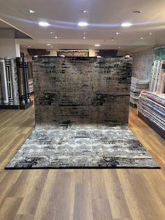 a carpet store with wooden floors and rugs