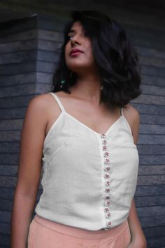 Linen top for women, White top, Linen tank top, Tops for summer, Made to order, Custom made, Plus sizeWear these linen tops with tight fitted jeans or loose bottoms.. these linen tops are meant to make you look more up to date with fashion with a touch of Indian folk embroidery.-Model height: 5'3" wearing size S-Top length: 22"-0.5" strap-Hand embroidered buttons-Closure: Front buttons**Note: Free Shipping time 15-21 days. Express Shipping time 5-7 days.** Cotton V-neck Summer Top, V-neck Cotton Top For Summer, Summer Camisole Tank Top, Summer Cotton V-neck Camisole, Fitted V-neck Summer Top, Fitted Tank Tops For Day Out, Fitted Linen Tops For Day Out, Trendy Fitted Sleeveless Crop Top, White Fitted Crop Tank Top