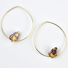 Handmade in France Hand painted porcelain Earring hoops are gold over brass Hoops measure 1.5" long ABOUT GOLDMAKERS JEWELRY Goldmakers Jewelry creates and curates a comprehensive selection of artfully designed hand-crafted jewelry. We aspire to offer the jewelry enthusiast access to affordable classics as well as fresh innovative designs. ABOUT NACH BIJOUX The Nach Bijoux brand brings a new concept in the market. The originality of our creations comes from the use of porcelain, alone or combine Gold Butterfly Metal Jewelry, Gold Metal Jewelry With Butterfly Clasp, Elegant Gold Butterfly Hoop Earrings, Gold Enamel Jewelry With Butterfly Charm, Gold Butterfly-shaped Brass Jewelry, Earring Hoops, Flowers Butterfly, Porcelain Earrings, Artfully Designed